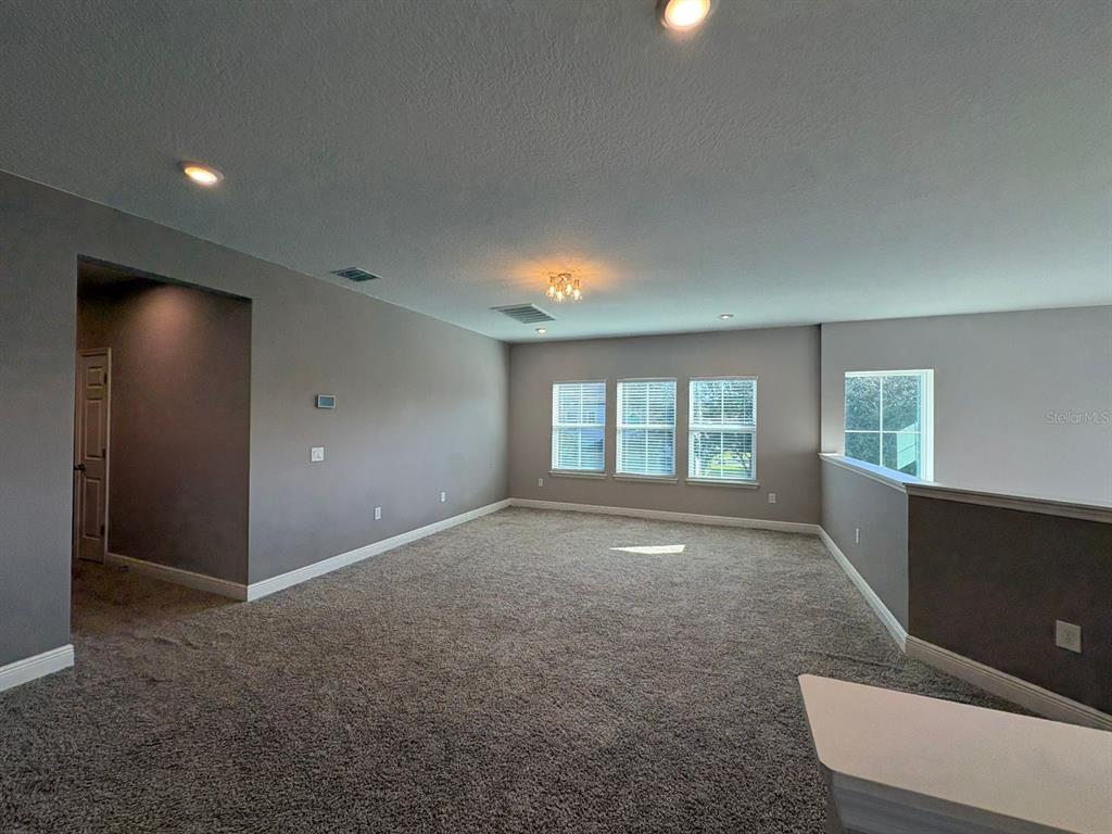 9640 Amber Chestnut Way Winter Garden, FL 34787 - Photo 14 of 32 an empty room with windows and closet