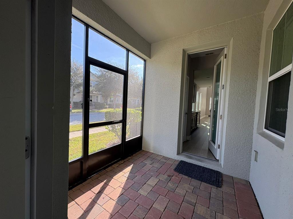 9640 Amber Chestnut Way Winter Garden, FL 34787 - Photo 6 of 32 a view of hallway with stairs and wooden floor