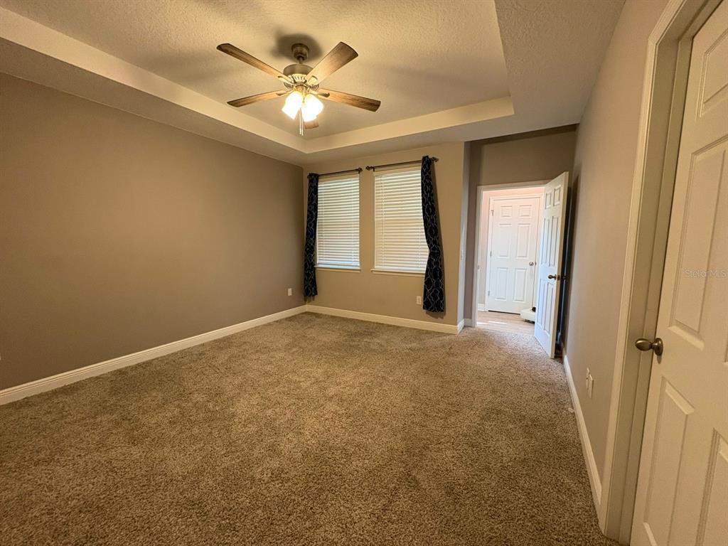9640 Amber Chestnut Way Winter Garden, FL 34787 - Photo 7 of 32 a view of an empty room with a window