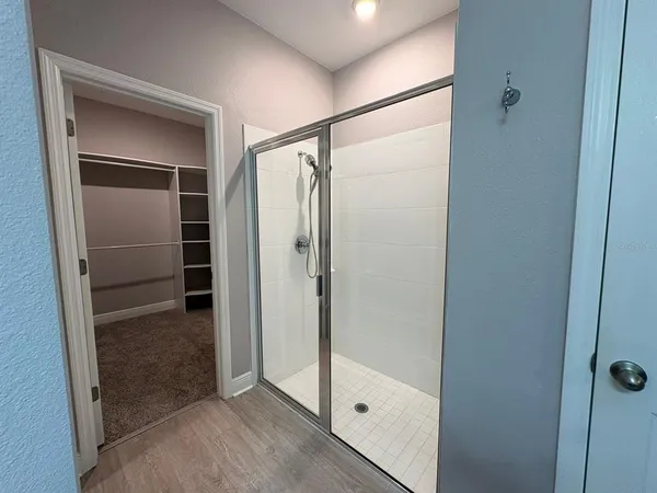 a bathroom with a toilet sink and a mirror