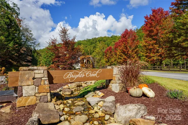 a view of a fountain in the backyard of the house
