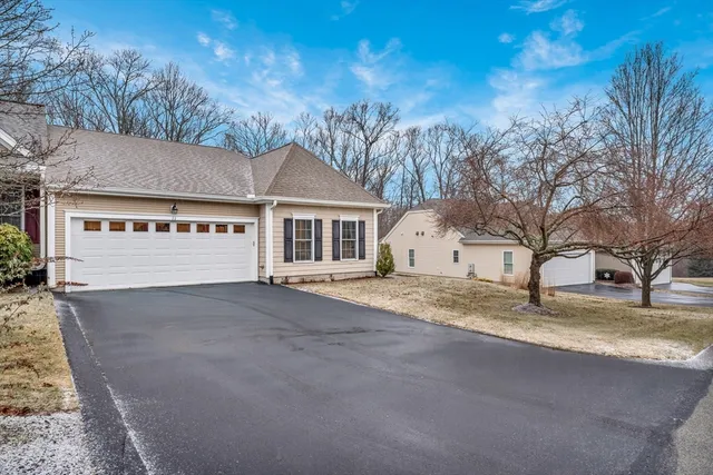 a view of a house with a snow in the yard