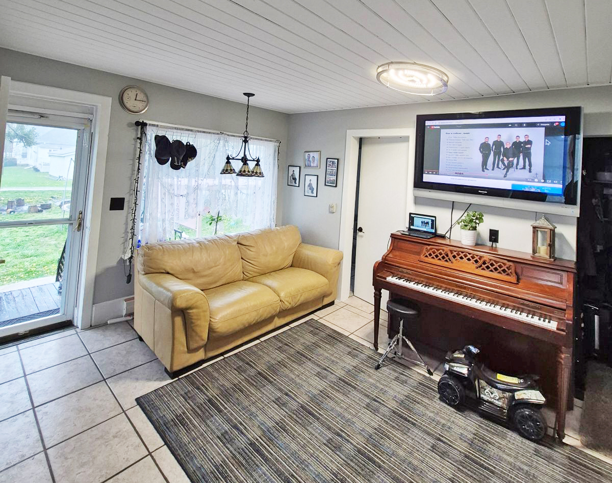 305 East Jackson Street Cullom, IL 60929 - Photo 11 of 23 a living room with furniture and a flat screen tv
