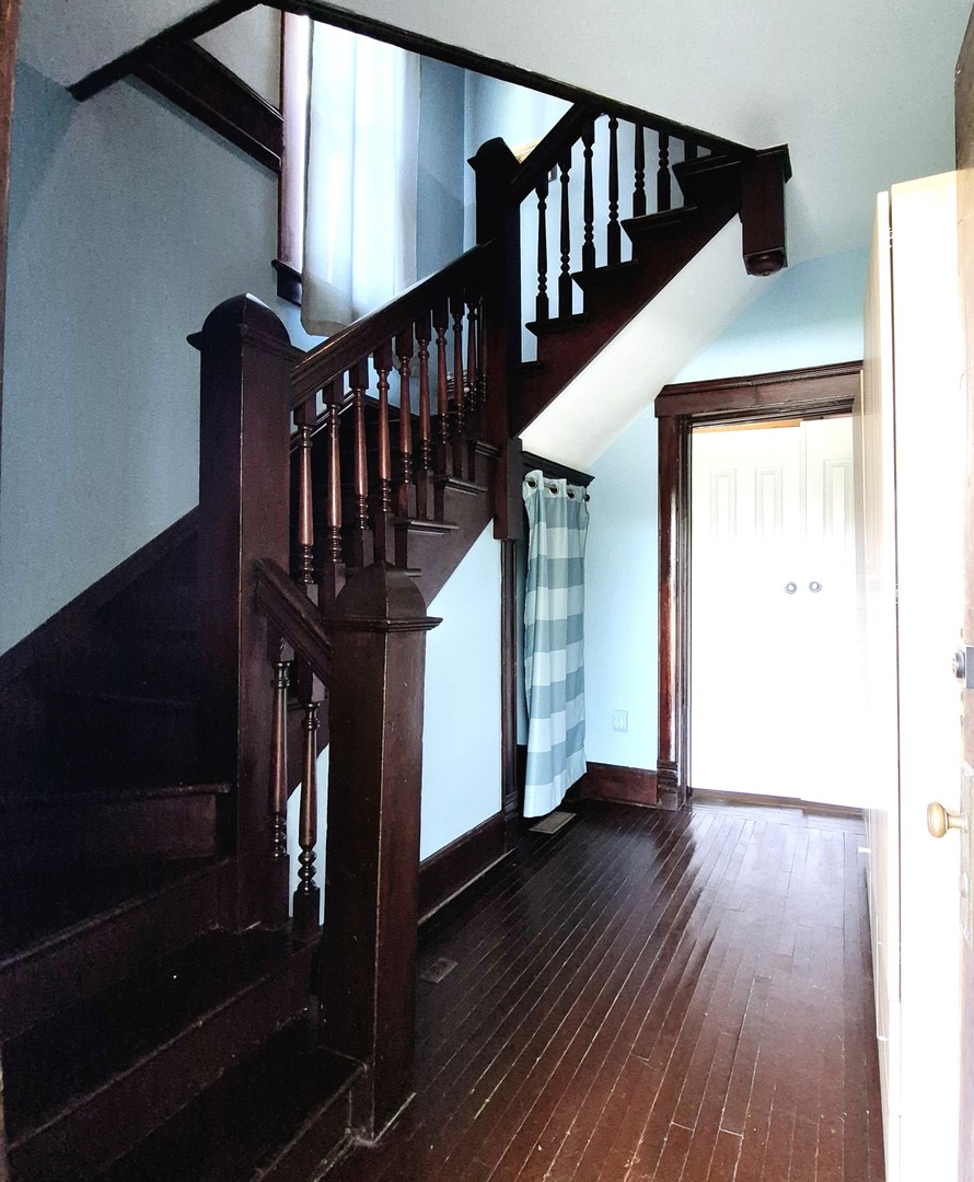 305 East Jackson Street Cullom, IL 60929 - Photo 17 of 23 a view of entryway with wooden floor and stairs
