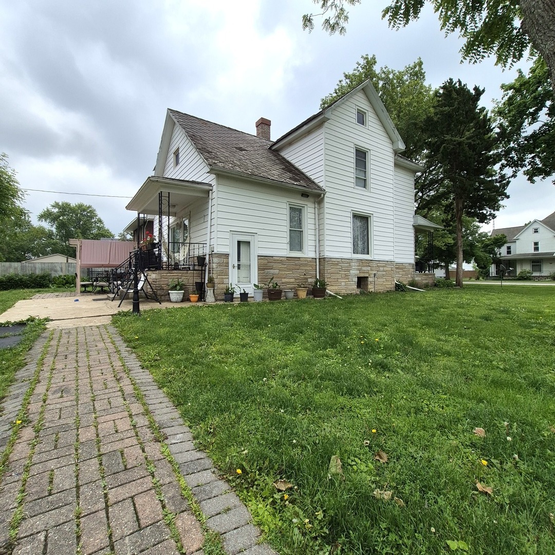 305 East Jackson Street Cullom, IL 60929 - Photo 22 of 23 a front view of house with yard