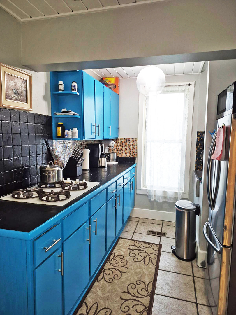 305 East Jackson Street Cullom, IL 60929 - Photo 10 of 23 a kitchen with a sink stove and cabinets