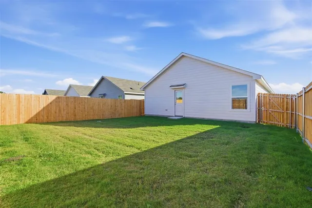 a view of a backyard with a garden