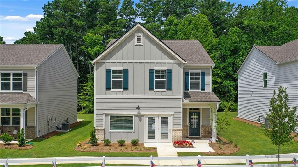 12158 Conrad Circle Hampton, GA 30228 - Photo 1 of 1 a front view of a house with a yard