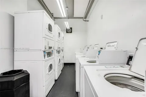 a kitchen with stainless steel appliances a sink and a refrigerator