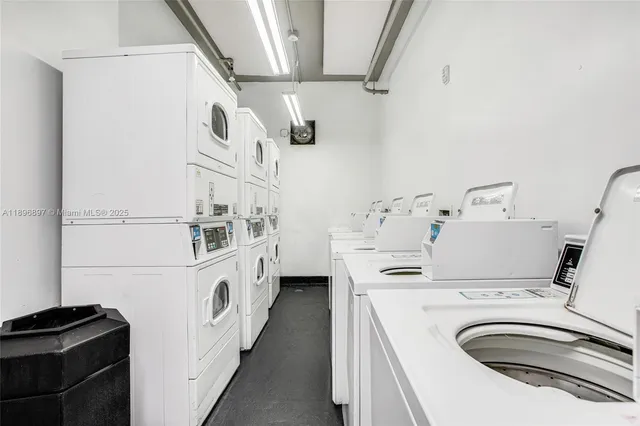 a kitchen with stainless steel appliances a sink and a refrigerator