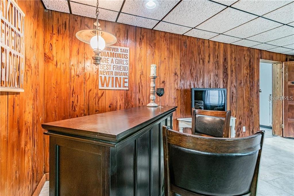 1453 Creek Road Wesley Chapel, FL 33543 - Photo 18 of 26 a room with furniture and a window