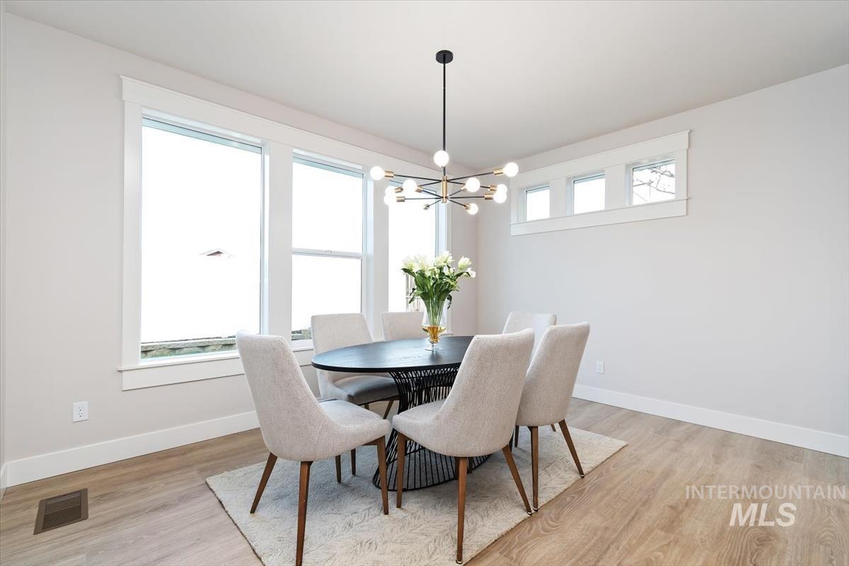 357 West Flour Mill Middleton, ID 83644 - Photo 18 of 49 Dining room featuring hanging lights and light wood-style floors