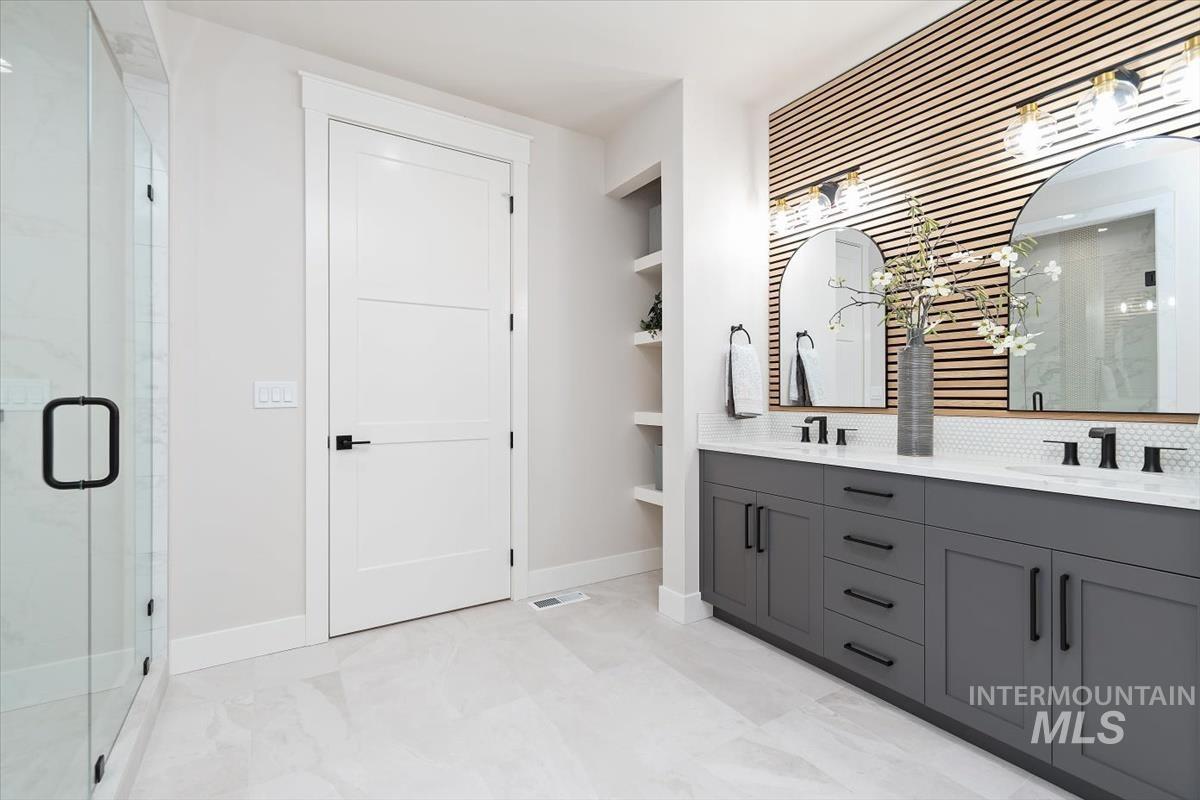 357 West Flour Mill Middleton, ID 83644 - Photo 22 of 49 Full bathroom with a marble finish shower, double vanity, built in features, and light marble finish flooring