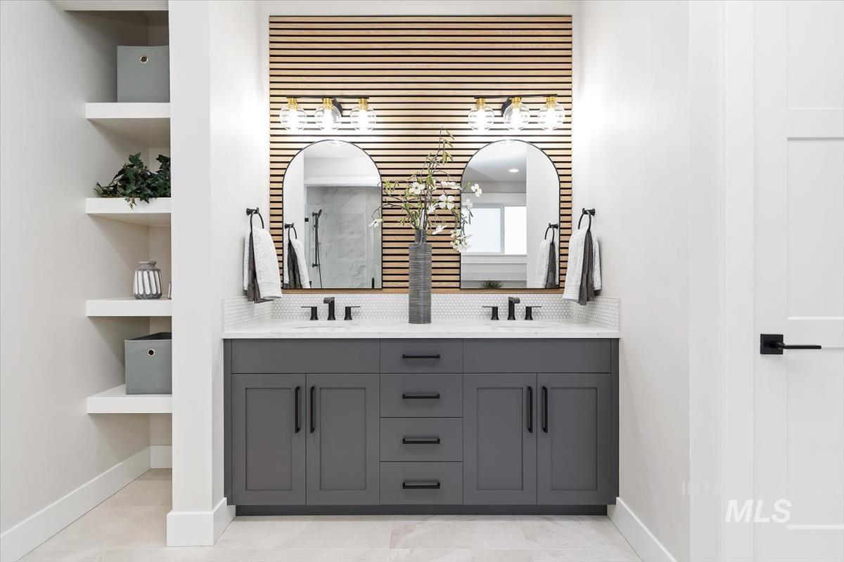 357 West Flour Mill Middleton, ID 83644 - Photo 23 of 49 Full bathroom featuring double vanity, decorative backsplash, and built in shelves