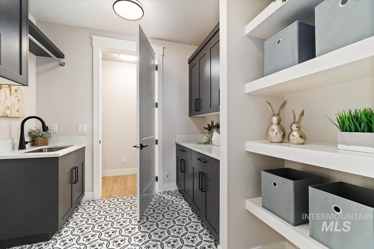 357 West Flour Mill Middleton, ID 83644 - Photo 31 of 49 Bar area featuring light stone countertops and open shelves