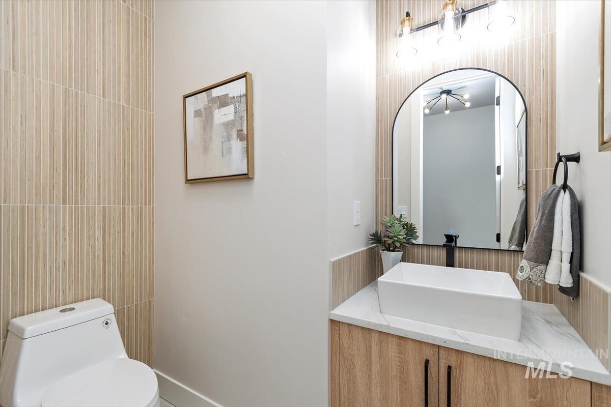 357 West Flour Mill Middleton, ID 83644 - Photo 34 of 49 Half bath with vanity and tile walls