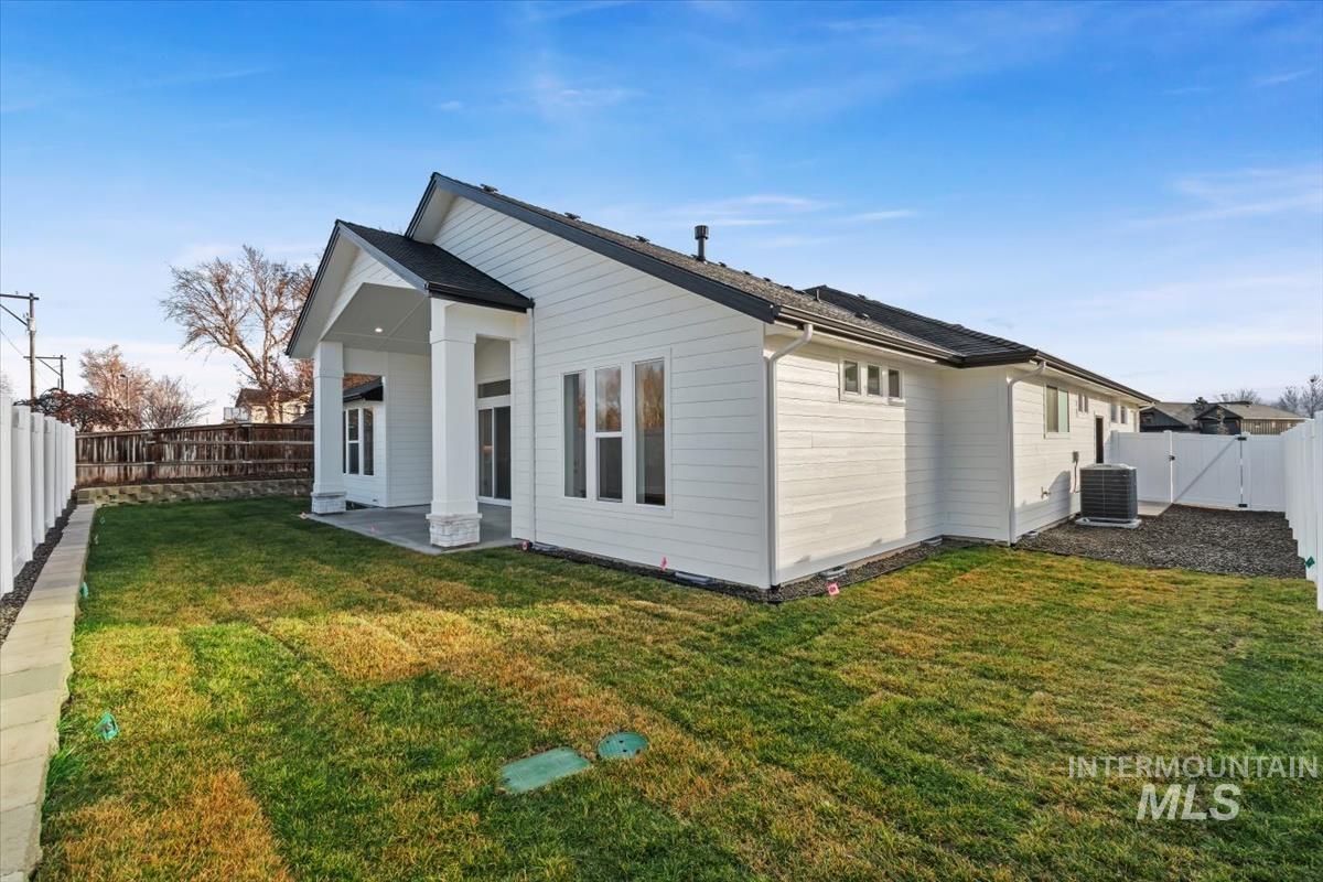 357 West Flour Mill Middleton, ID 83644 - Photo 40 of 49 Rear view of property with a fenced backyard, a gate, and a patio area