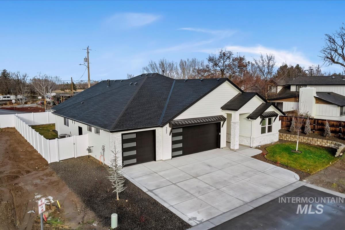 357 West Flour Mill Middleton, ID 83644 - Photo 45 of 49 View of front of home with driveway, roof with shingles, a garage, and a gate