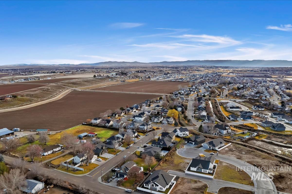 357 West Flour Mill Middleton, ID 83644 - Photo 47 of 49 Aerial view of property and surrounding area featuring nearby suburban area and a mountainous background