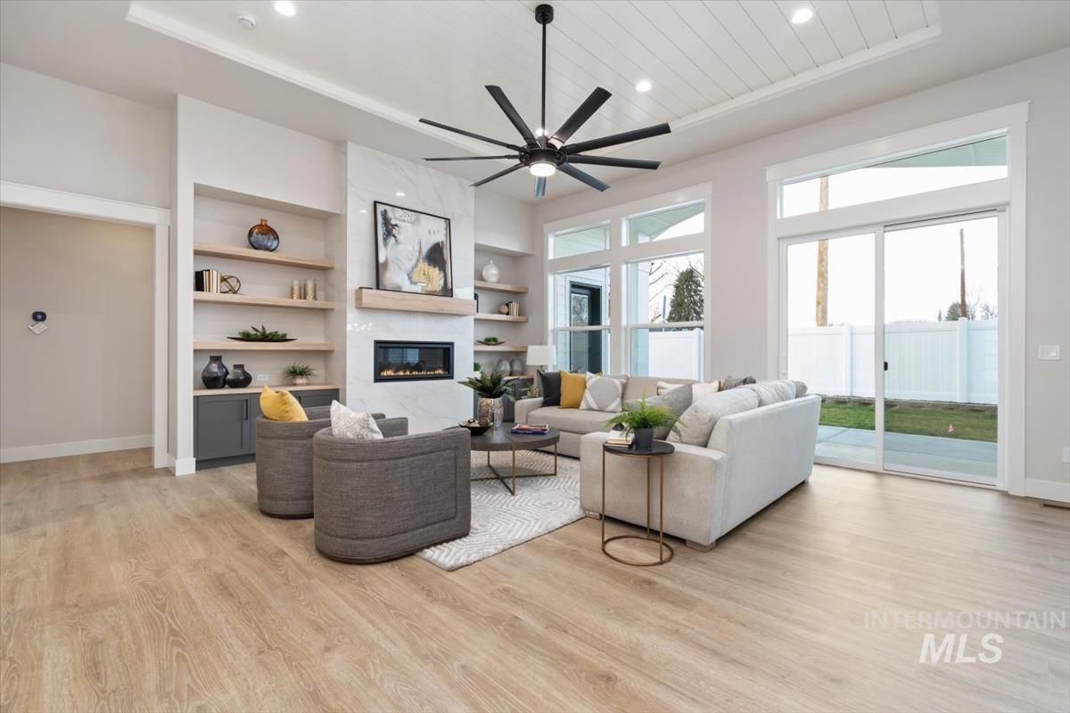 357 West Flour Mill Middleton, ID 83644 - Photo 6 of 49 Living area featuring ceiling fan, light wood-style flooring, a fireplace, built in features, and recessed lighting