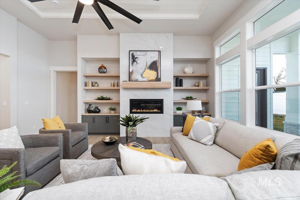 357 West Flour Mill Middleton, ID 83644 - Photo 8 of 49 Living room featuring a ceiling fan, a fireplace, light wood finished floors, and built in features