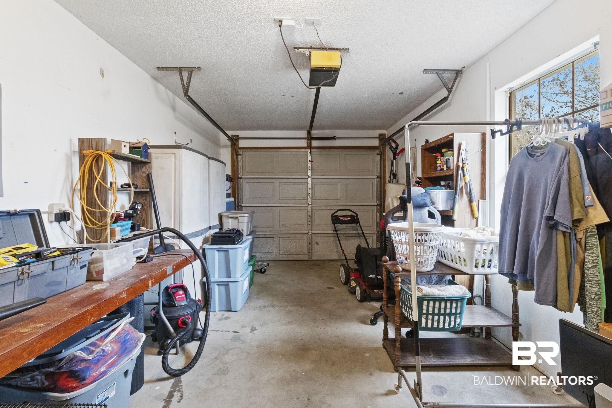 14031 Brook Hollow Road Summerdale, AL 36580 - Photo 41 of 56 Garage with a garage door opener