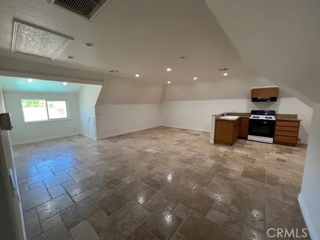 a view of a livingroom with kitchen