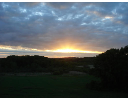 4 Upland Road Ipswich, MA 01938 - Photo 3 of 13 a view of sunset and yard