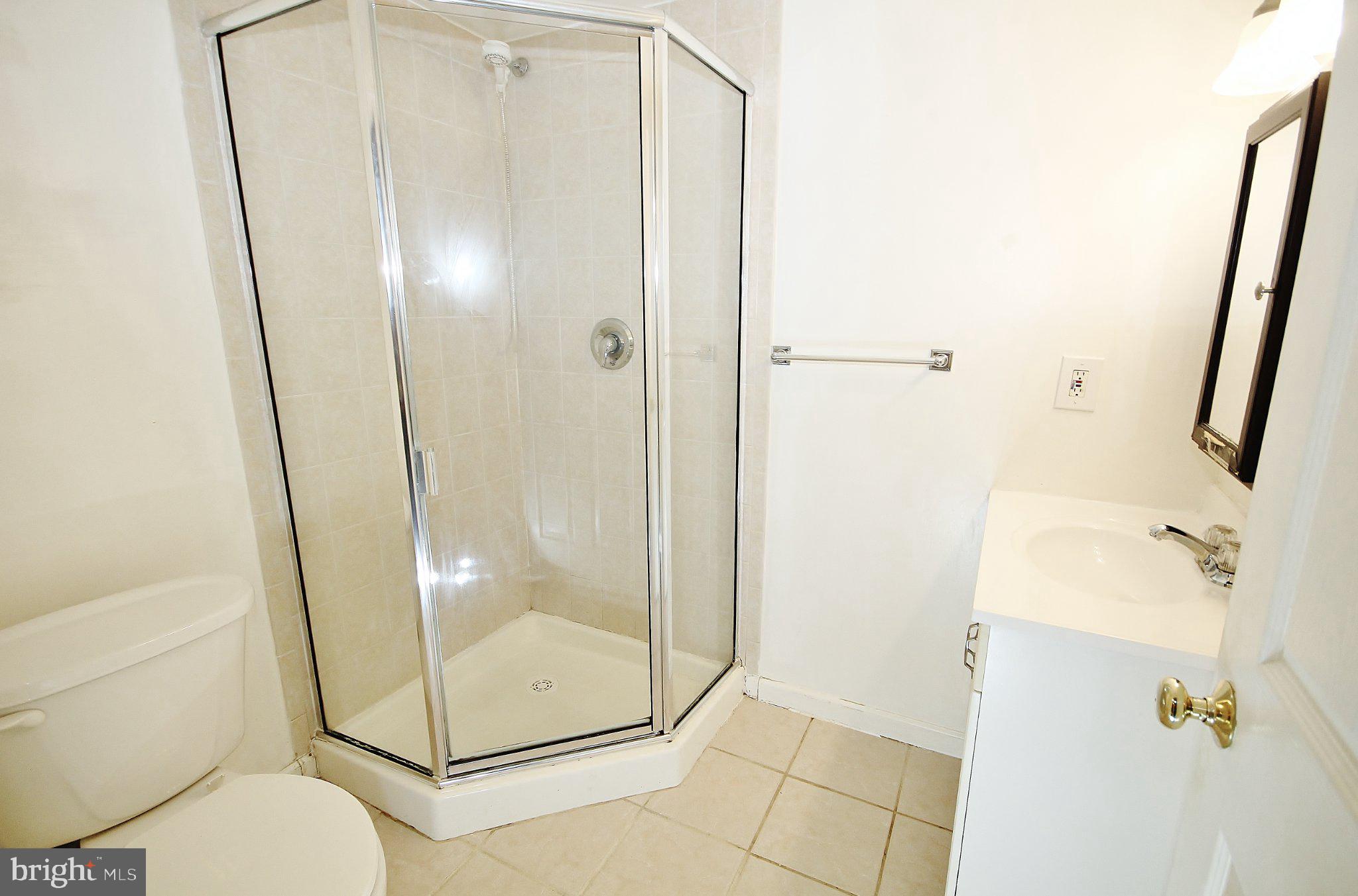 5504 Inverchapel Road Springfield, VA 22151 - Photo 36 of 51 Modern bathroom with sleek shower.
