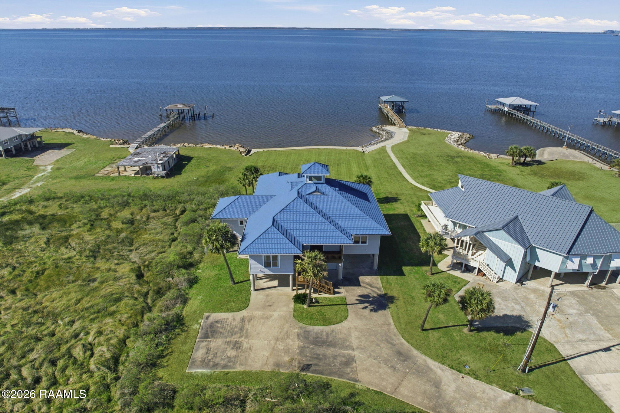 133 Pelican Lane Lake Charles, LA 70607 - Photo 2 of 36 2-web-or-mls-DJI_0535_grass_fcf1db2d-236