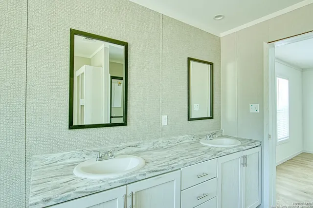 a bathroom with 2 sink and a mirror