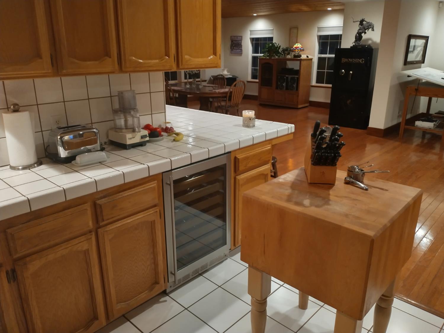 37647 Verde Avenue Madera, CA 93636 - Photo 5 of 12 a kitchen with a sink refrigerator and cabinets