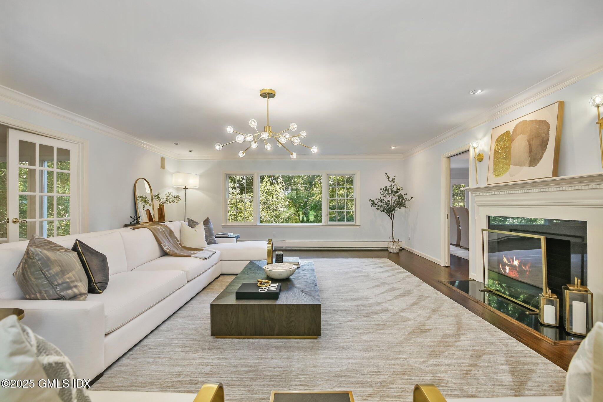 8 Tinker Lane Greenwich, CT 06830 - Photo 1 of 41 a living room with furniture and a fireplace