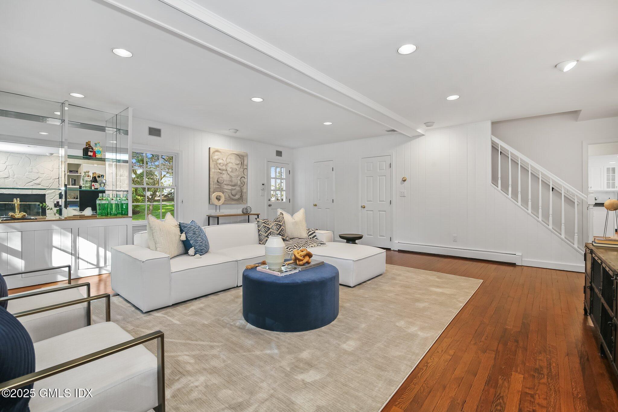 8 Tinker Lane Greenwich, CT 06830 - Photo 17 of 41 a living room with furniture and a wooden floor