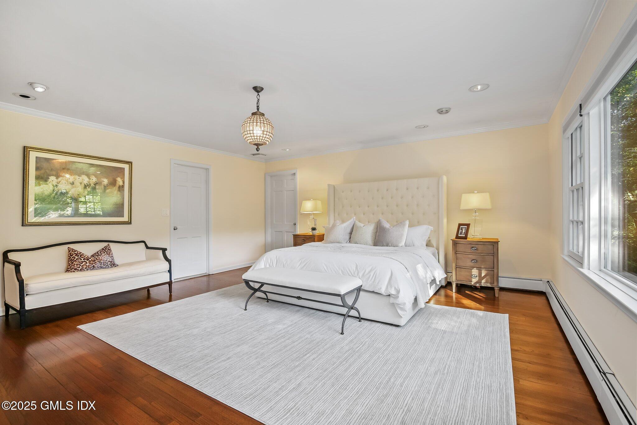 8 Tinker Lane Greenwich, CT 06830 - Photo 20 of 41 a spacious bedroom with a bed and a couch