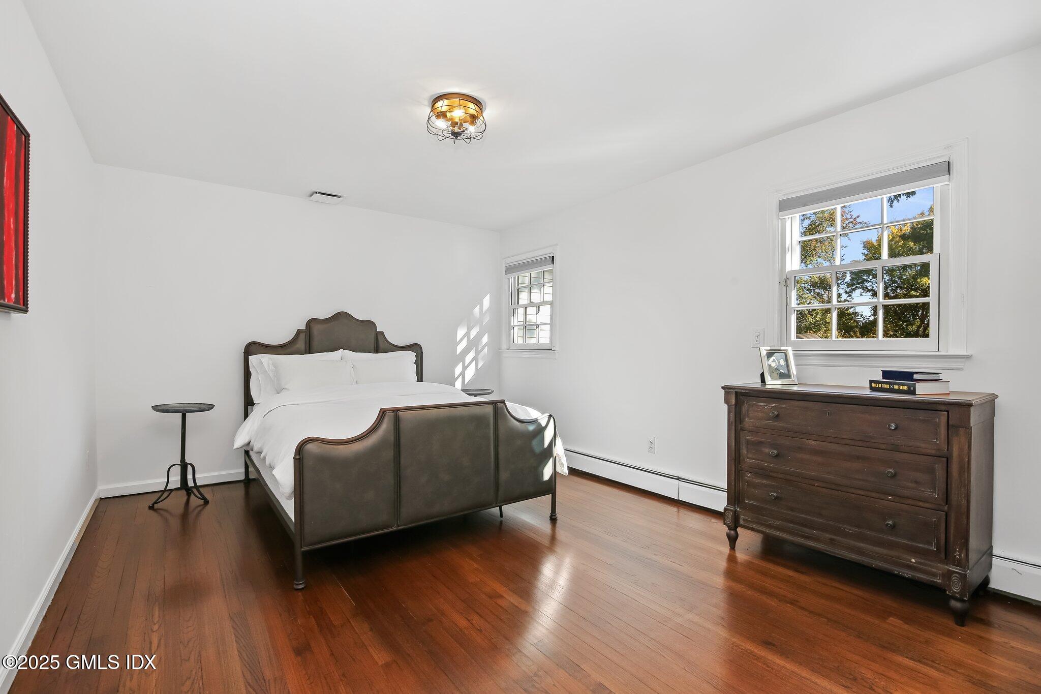 8 Tinker Lane Greenwich, CT 06830 - Photo 24 of 41 a living room with furniture and a wooden floor