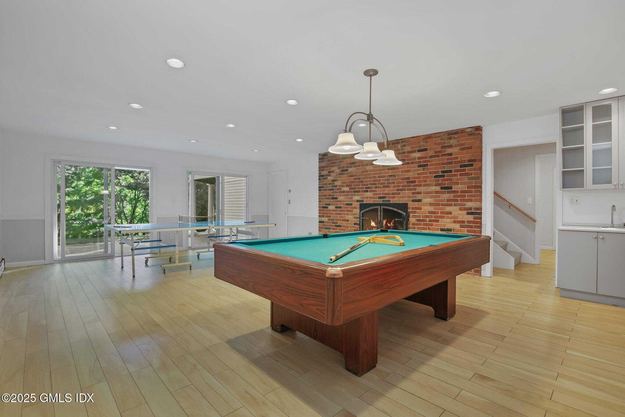 8 Tinker Lane Greenwich, CT 06830 - Photo 27 of 41 a room with pool table and windows