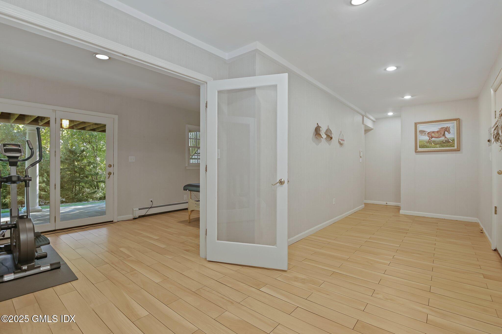 8 Tinker Lane Greenwich, CT 06830 - Photo 30 of 41 a view of an empty room with glass door and a window