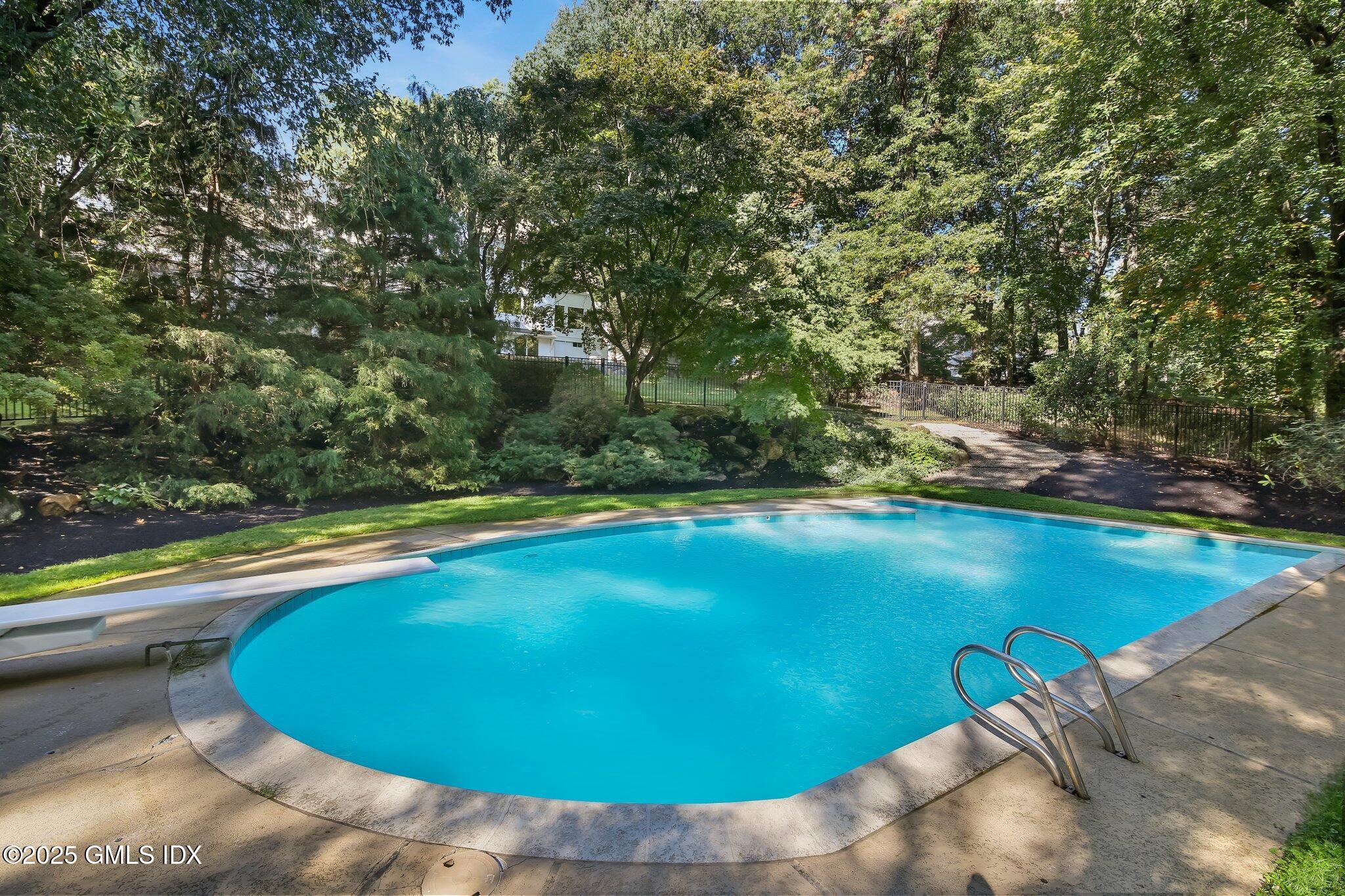 8 Tinker Lane Greenwich, CT 06830 - Photo 35 of 41 a view of a swimming pool and an outdoor space
