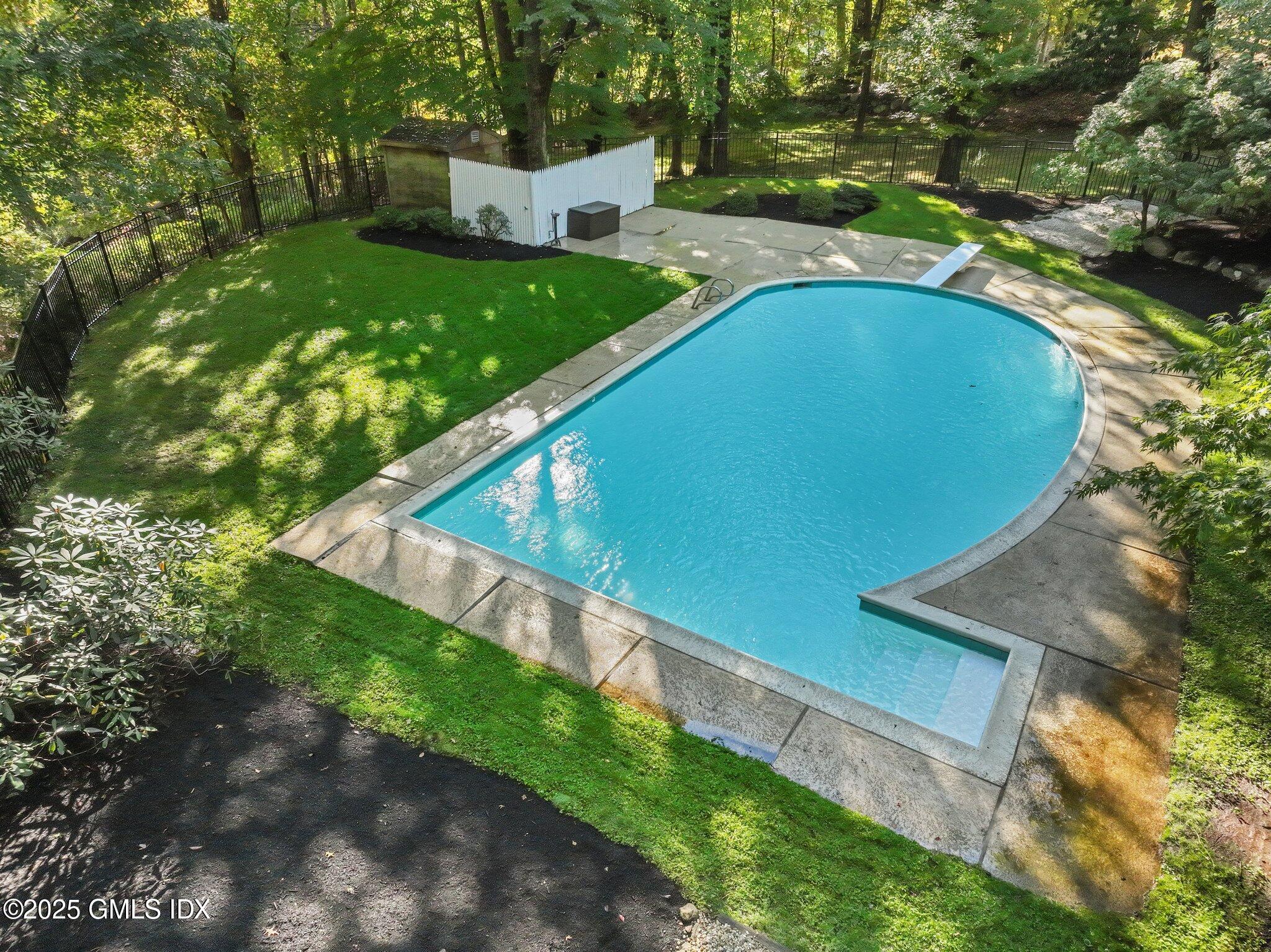 8 Tinker Lane Greenwich, CT 06830 - Photo 36 of 41 a view of a backyard with a garden