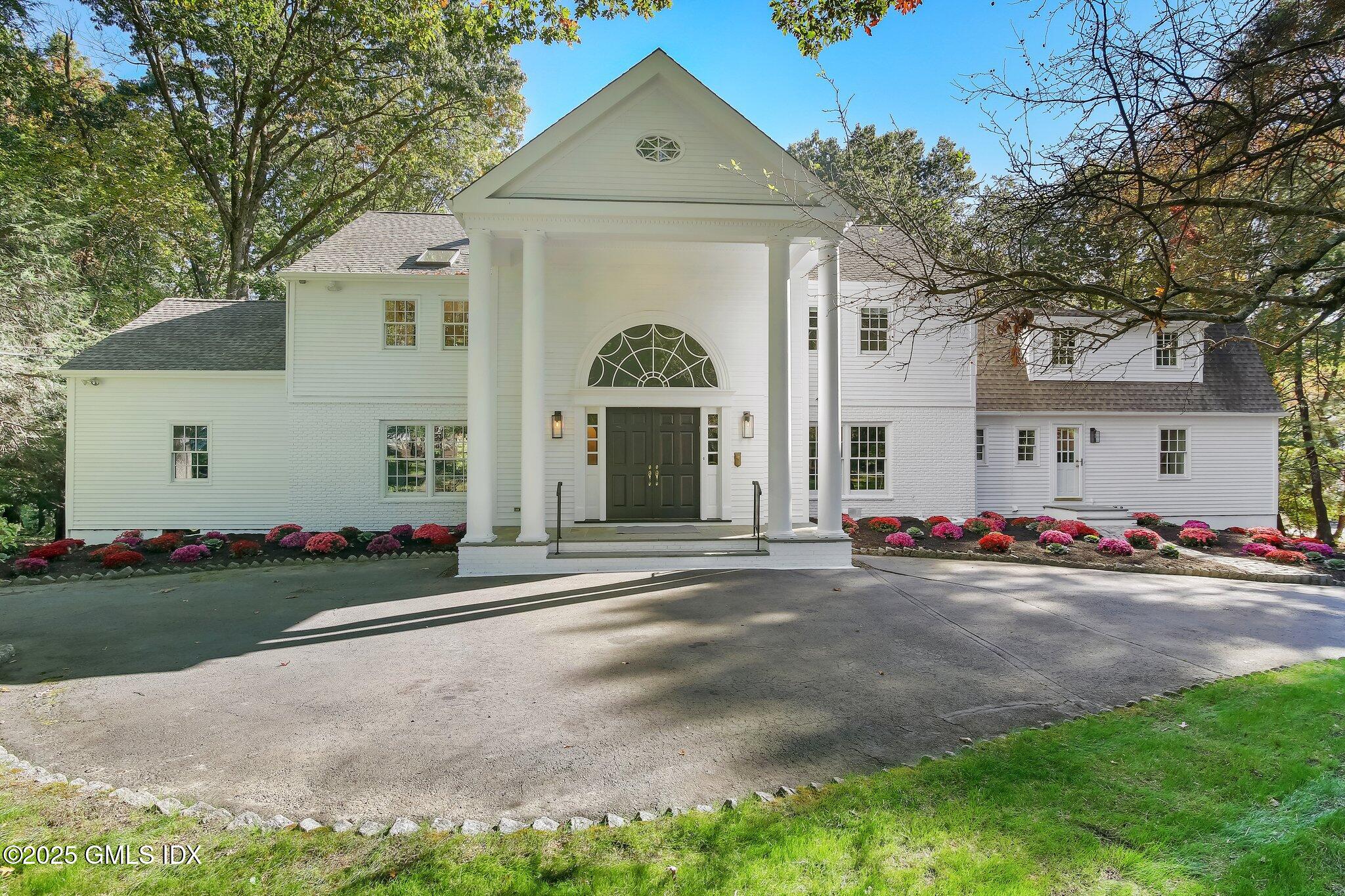 8 Tinker Lane Greenwich, CT 06830 - Photo 38 of 41 front view of a house with a street