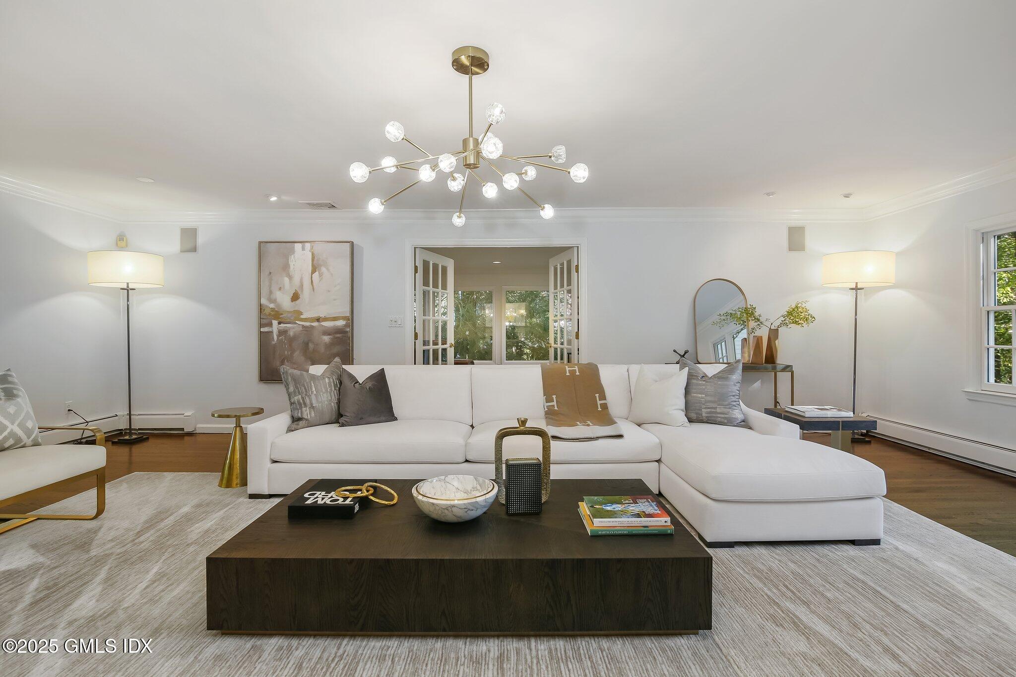 8 Tinker Lane Greenwich, CT 06830 - Photo 5 of 41 a living room with furniture a lamp and a chandelier