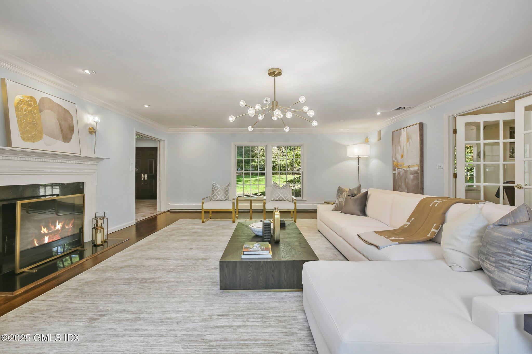 8 Tinker Lane Greenwich, CT 06830 - Photo 6 of 41 a living room with furniture and a fireplace