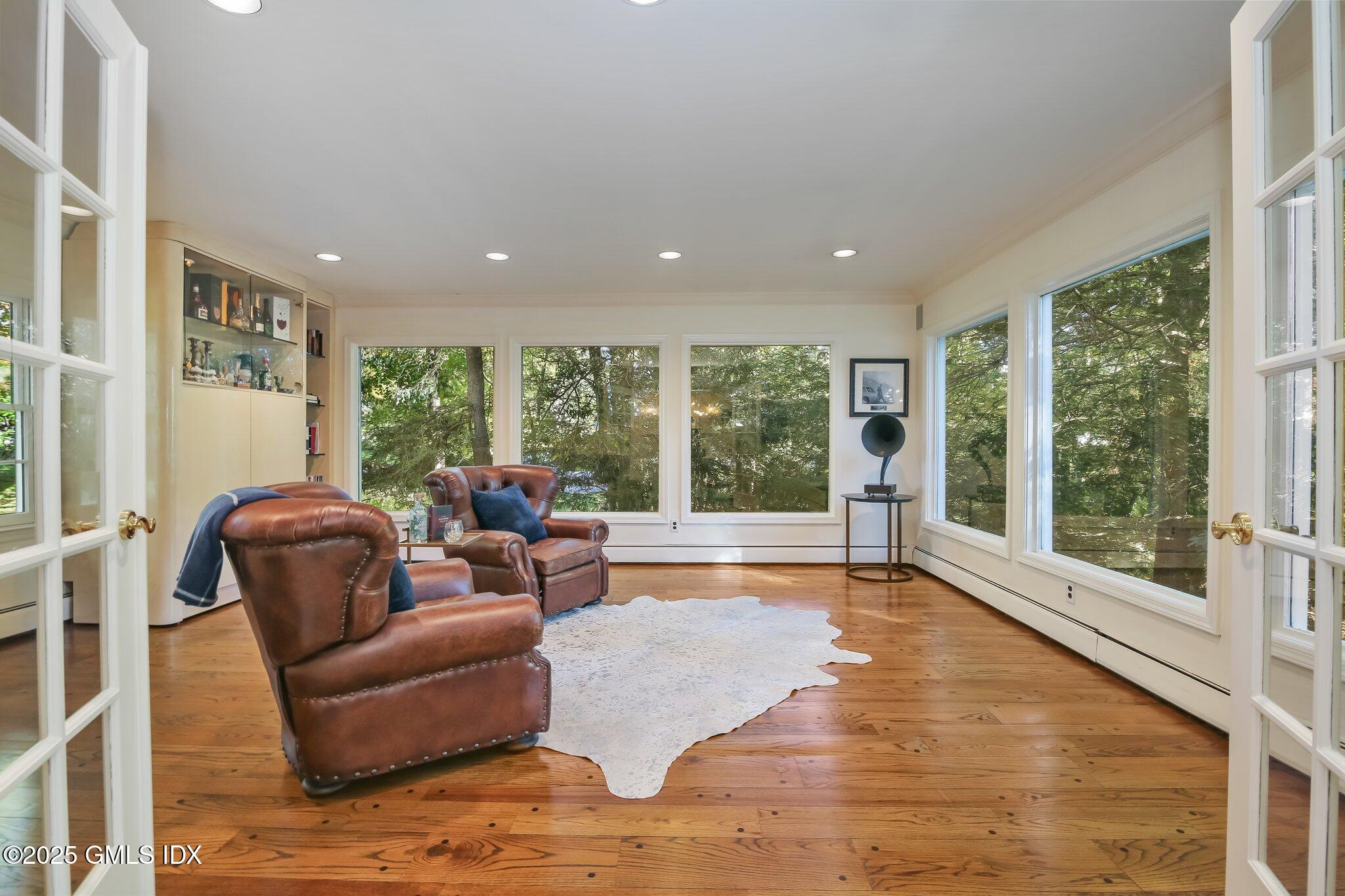 8 Tinker Lane Greenwich, CT 06830 - Photo 10 of 41 a living room with furniture and large windows