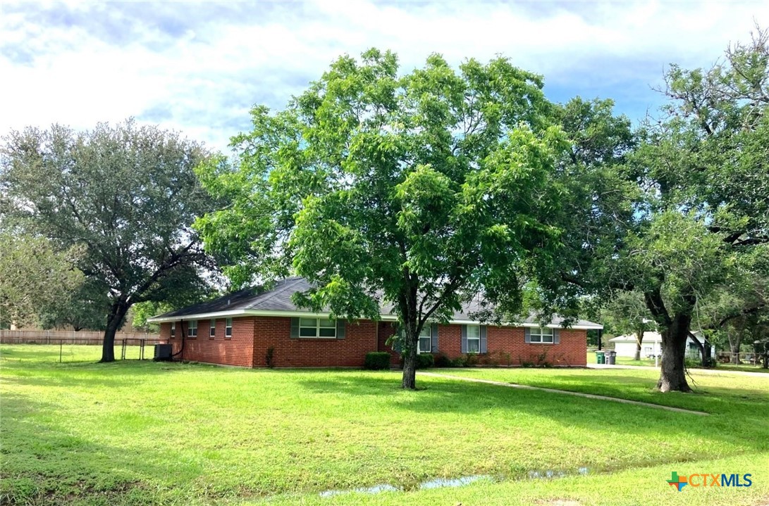 502 Cannon Road Victoria, TX 77904 - Photo 3 of 3 a front view of a house with a garden