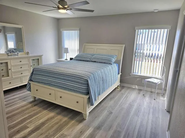 a bedroom with a bed and a dresser