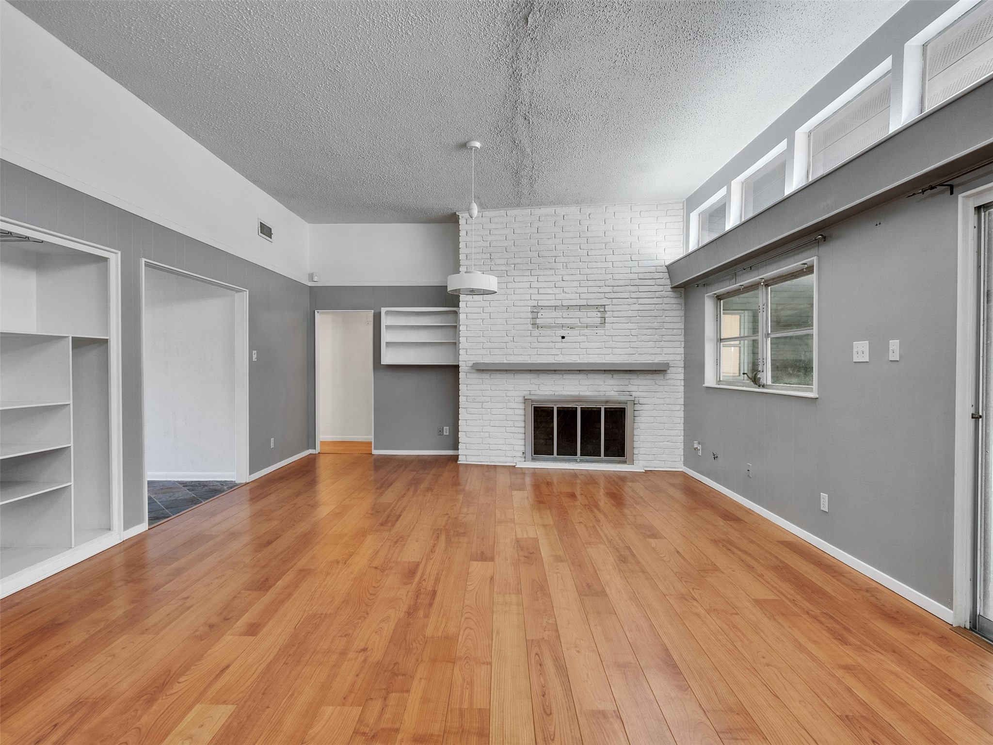 2011 Durrain Ferry Road Baytown, TX 77520 - Photo 7 of 32 Inviting living space with fireplace and sliding doors leading to patio.