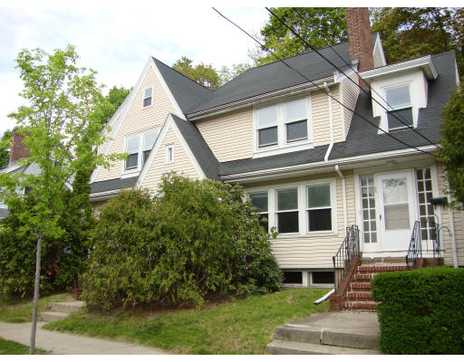 69-71 Beaconsfield Road Brookline, MA 02445 - Photo 1 of 1 a view of a white house next to a yard with big trees