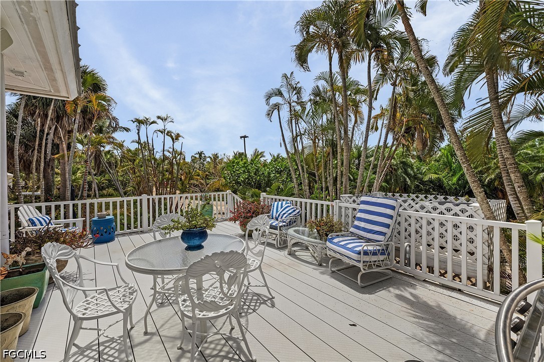 515 Useppa Useppa Island Bokeelia, FL 33922 - Photo 37 of 43 a view of a chairs and table on the deck