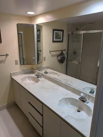 a bathroom with a sink and a mirror